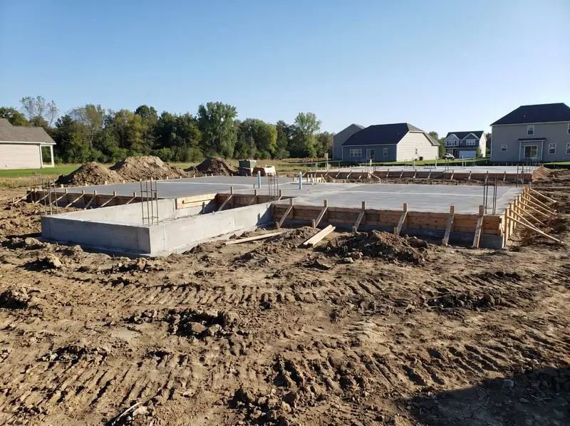 Slabs and foundations poured at Maple Ridge, June 2026. Artist's concept.